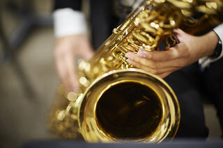 A person playing the saxophone